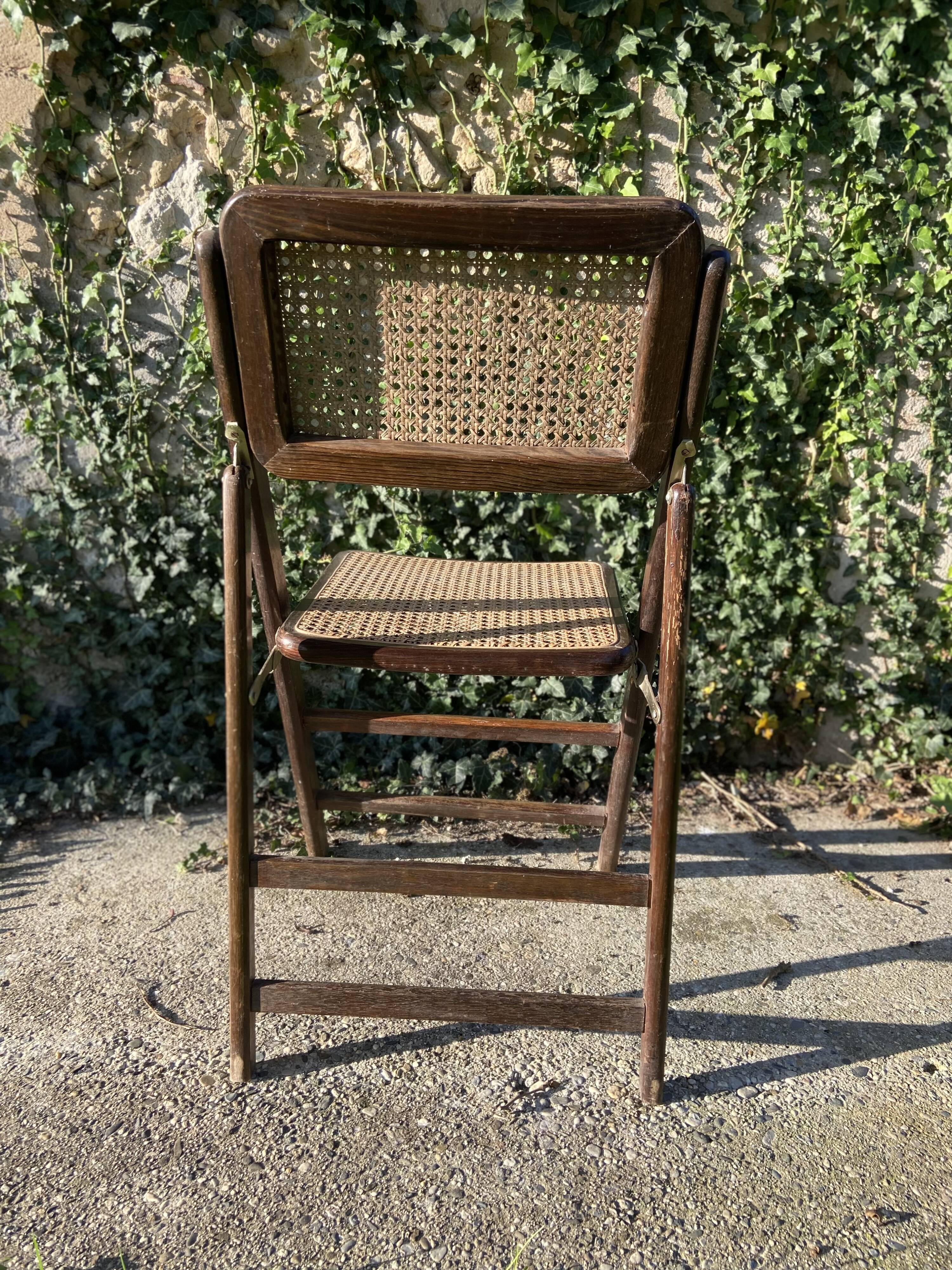 Folding chair in wood and cane.