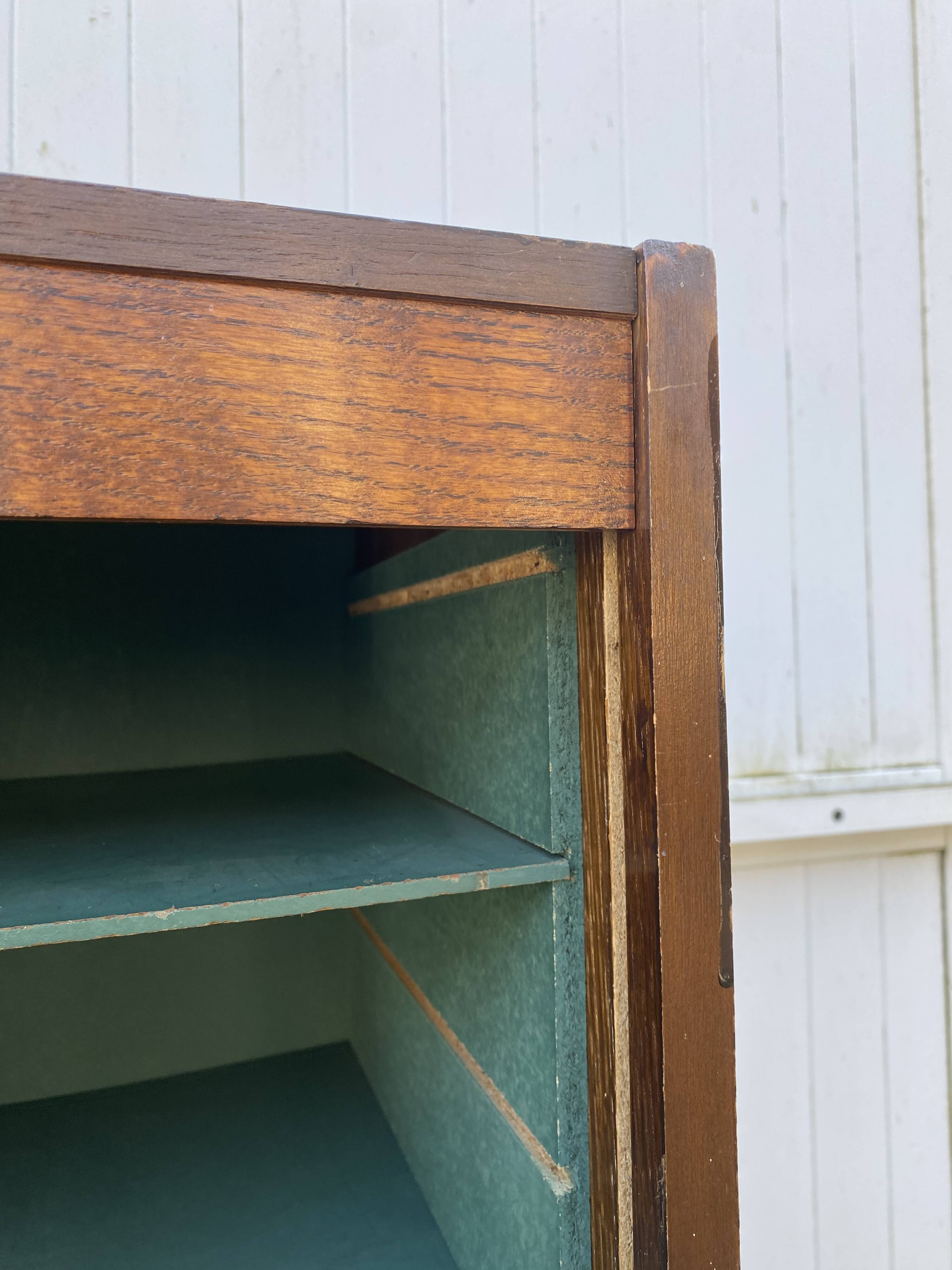 1970 oak office storage cabinet with curtains.