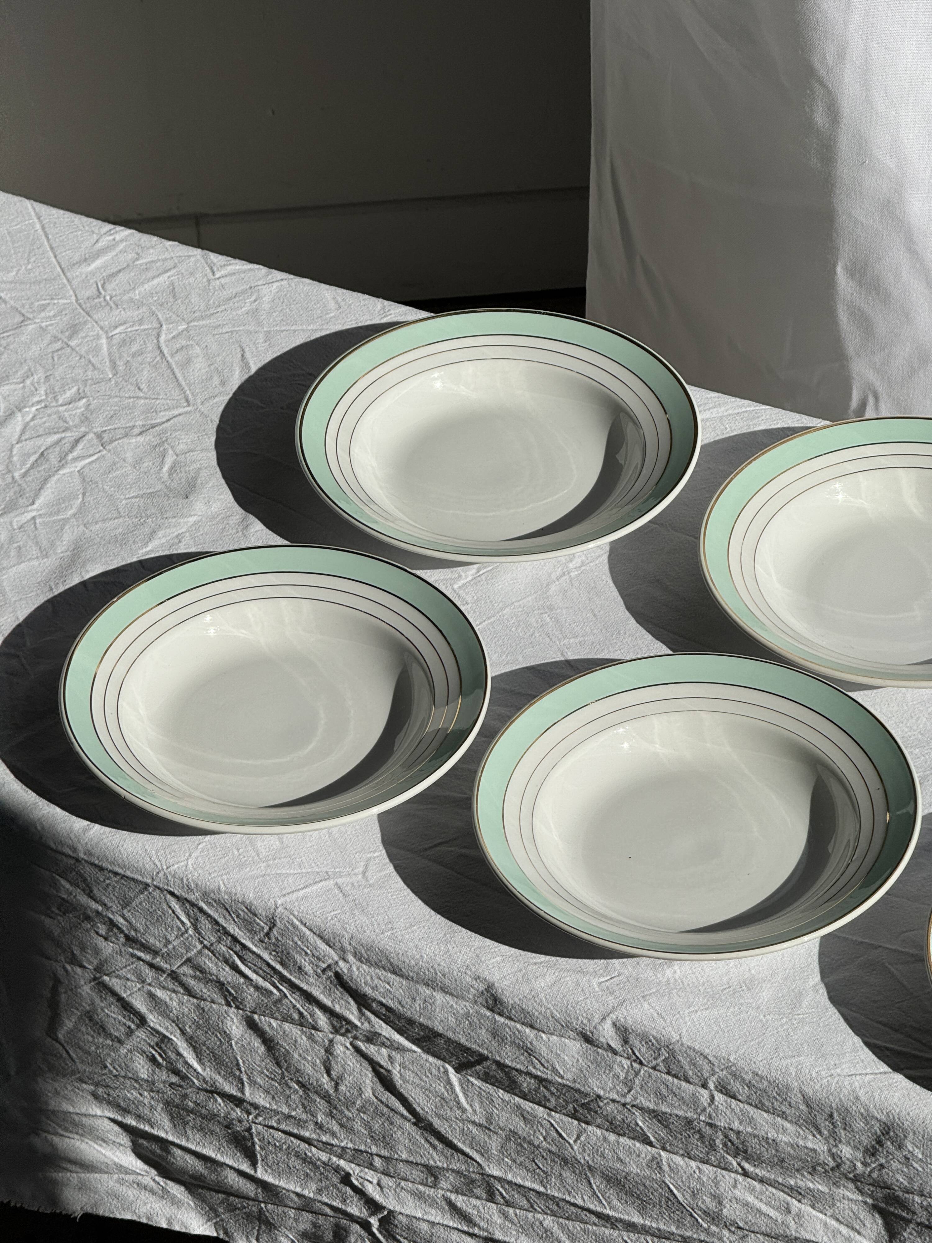 Set of 8 antique turquoise deep plates with a gold rim D22.5