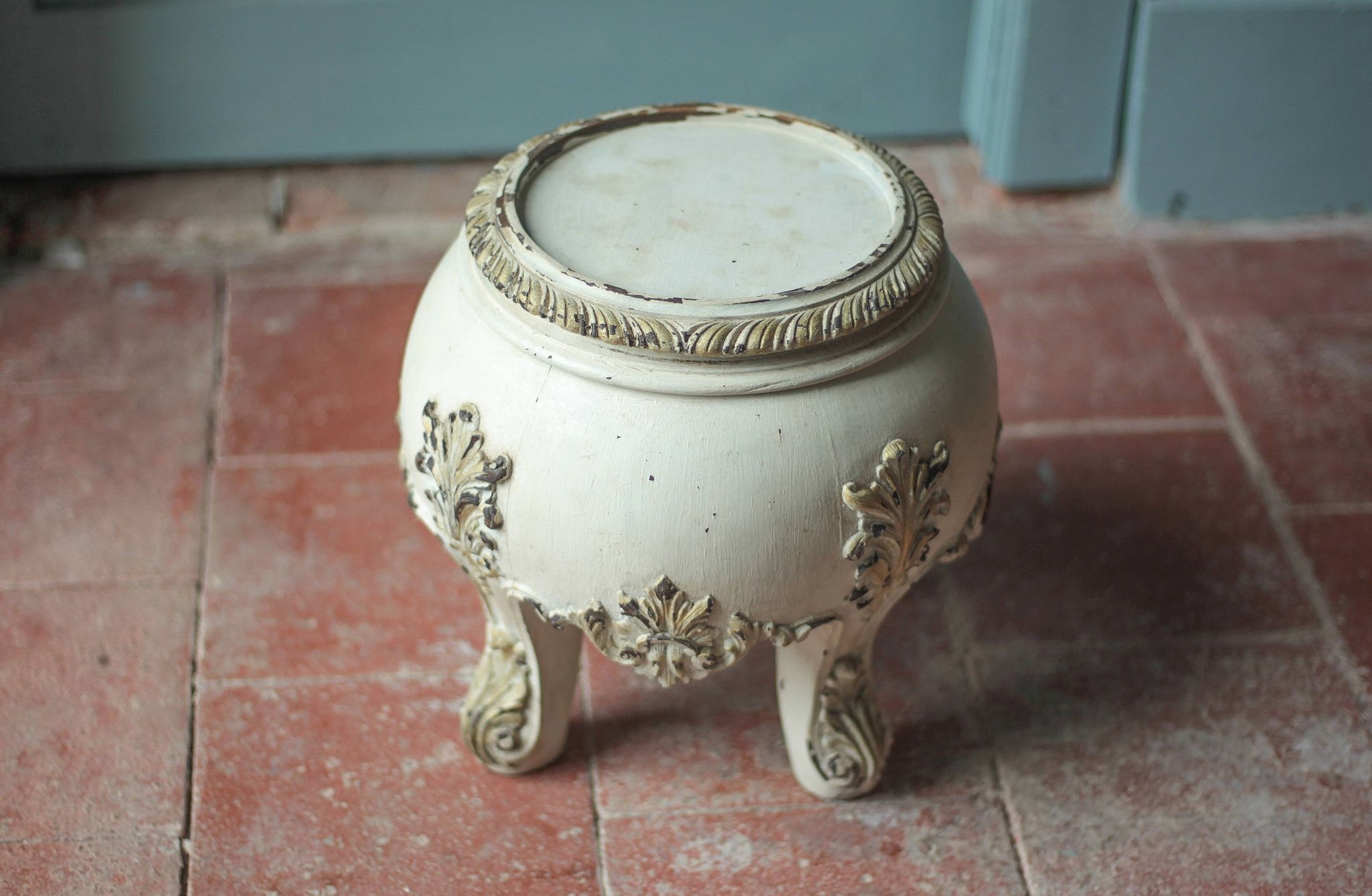 Solid wood plant stand with Louis XV style palm leaf motifs.