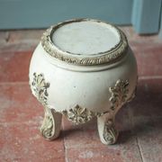 Solid wood plant stand with Louis XV style palm leaf motifs.