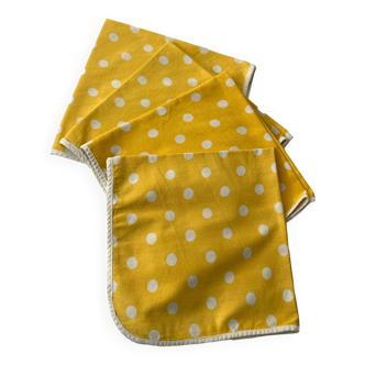 4 yellow napkins with white polka dots