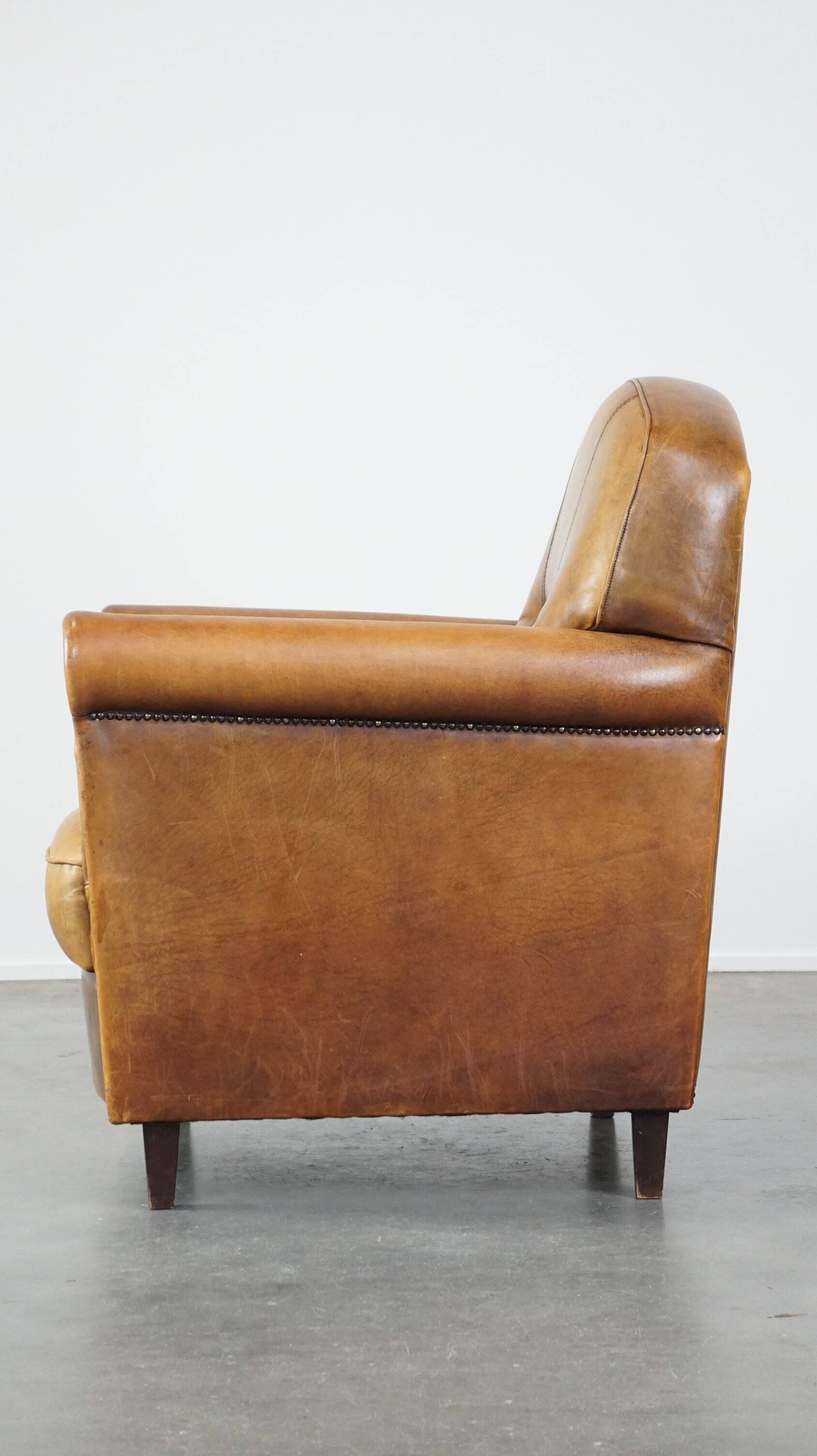 Stately, sleekly finished, comfortable sheepskin armchair