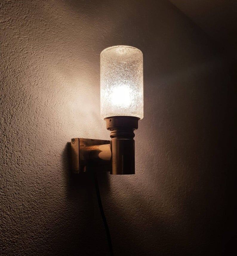 Brass applique with 1970 glass lampshade