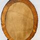 Vintage oval wicker mirror from the 1960s.