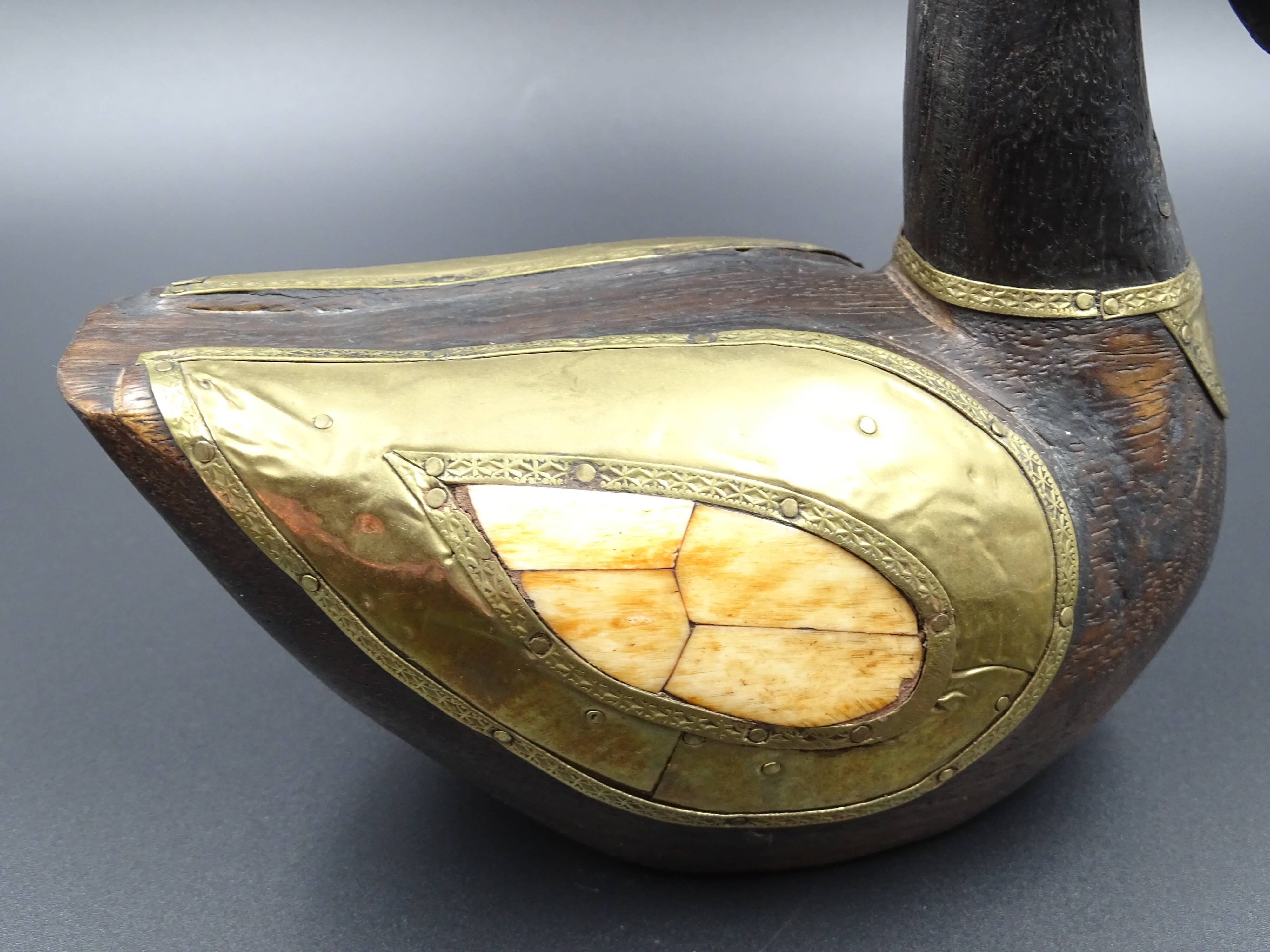 Wooden and brass swan