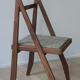 Walnut chair designed by Martin Gillis Studio