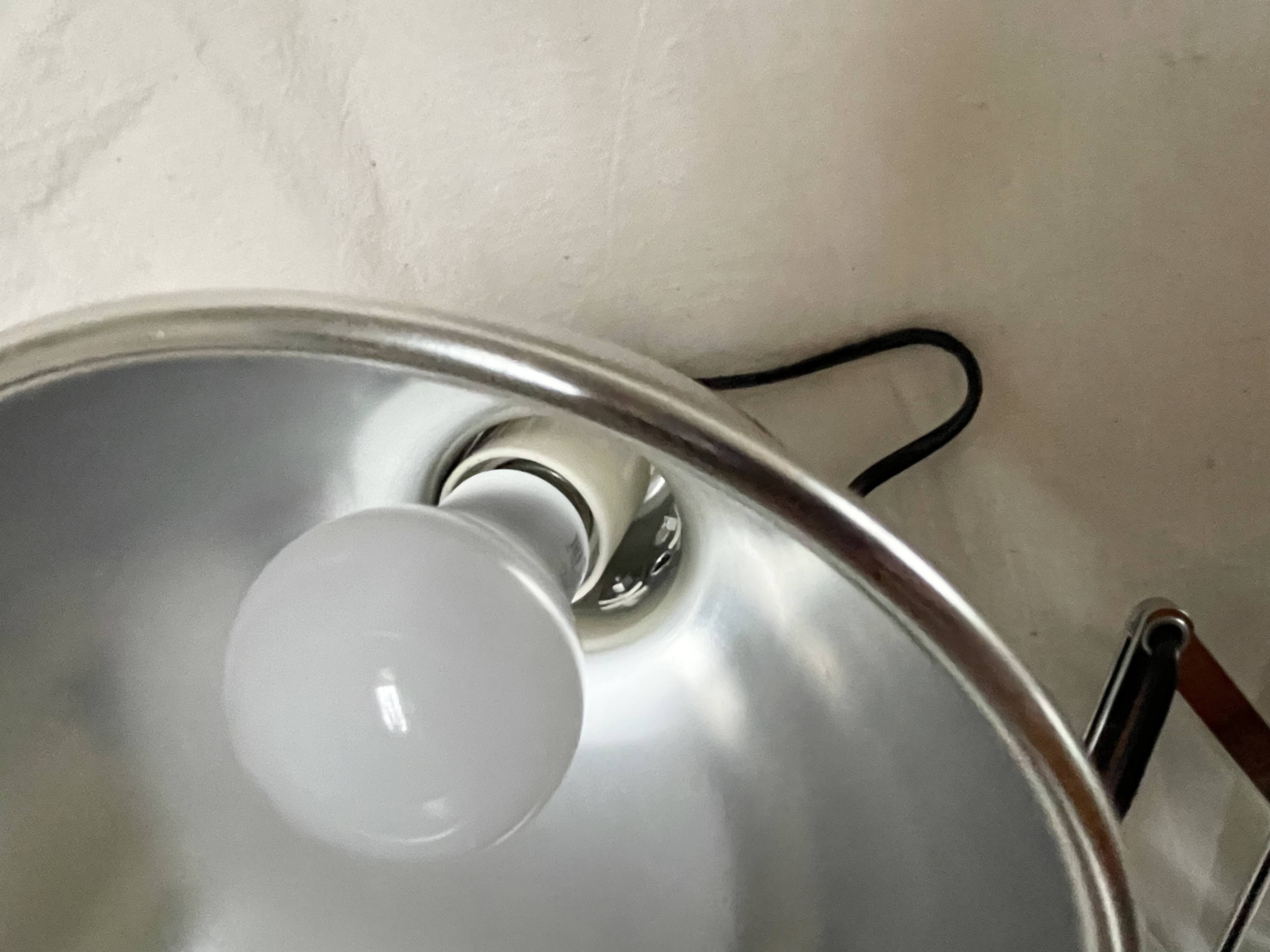 Vintage accordion wall light in chrome metal.