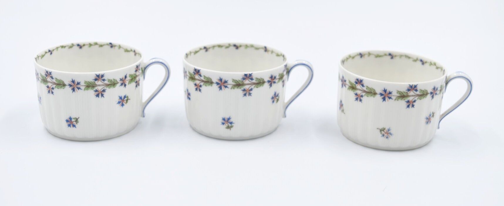 Three cups and under porcelain tea cups from Limoges Haviland barbed-wire décor