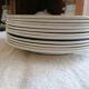 Set of 11 flat earthenware plates