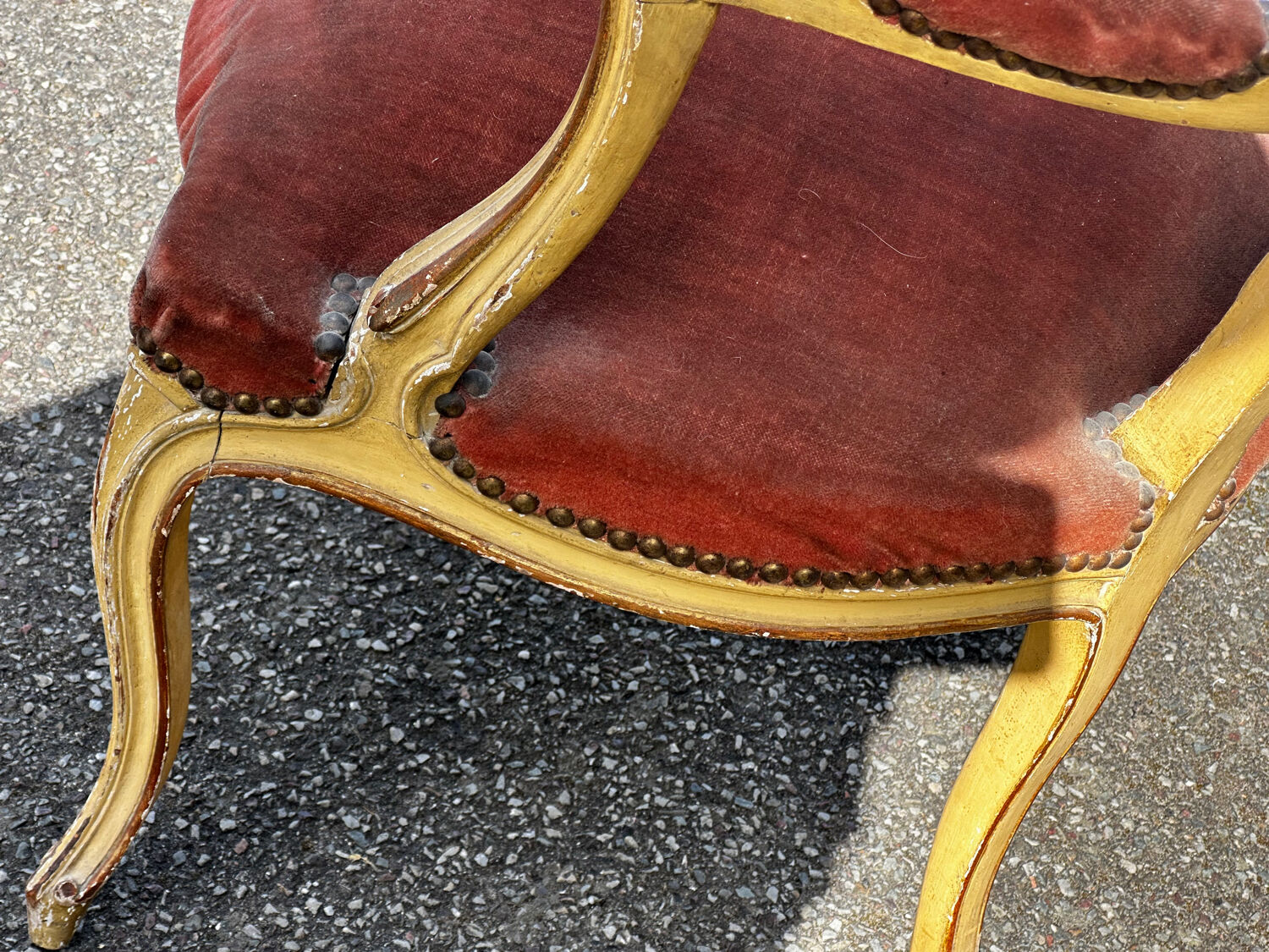 Louis XV cabriolet armchair, patinated wood and antique velvet.