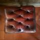 Red leather footrest in Chesterfield style, vintage 1970s.