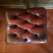 Red leather footrest in Chesterfield style, vintage 1970s.