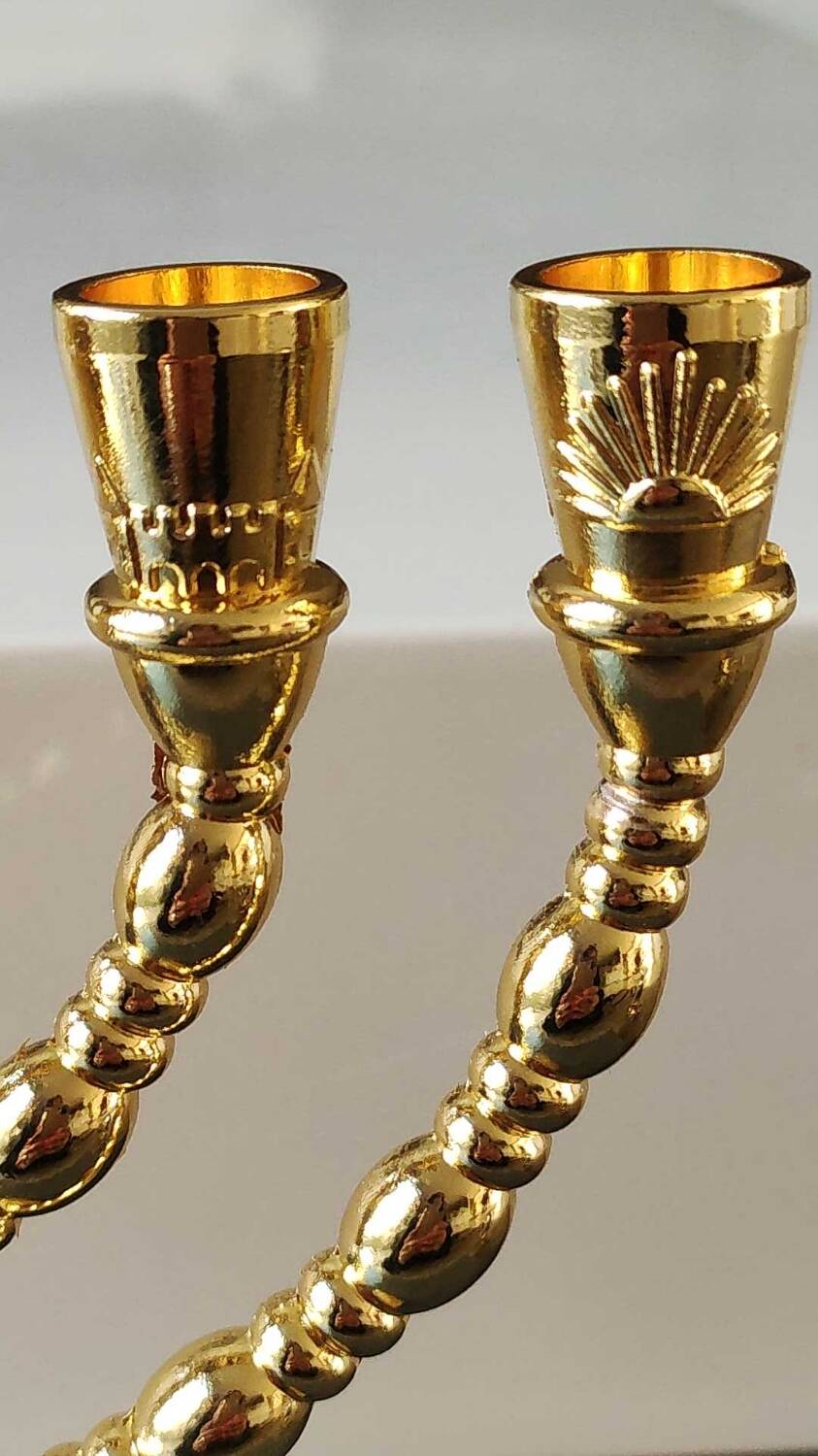 Menorah/Jewish/Hebrew candlestick with 7 arms of light. Engraved with the symbols of the 12 tribes of Israel/Holyland inscription. In gold metal. Size 20 x 16 cm