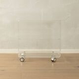 Wonderful side table from the 1960s, high-quality frame and shelf made of transparent acrylic with chrome-plated castors