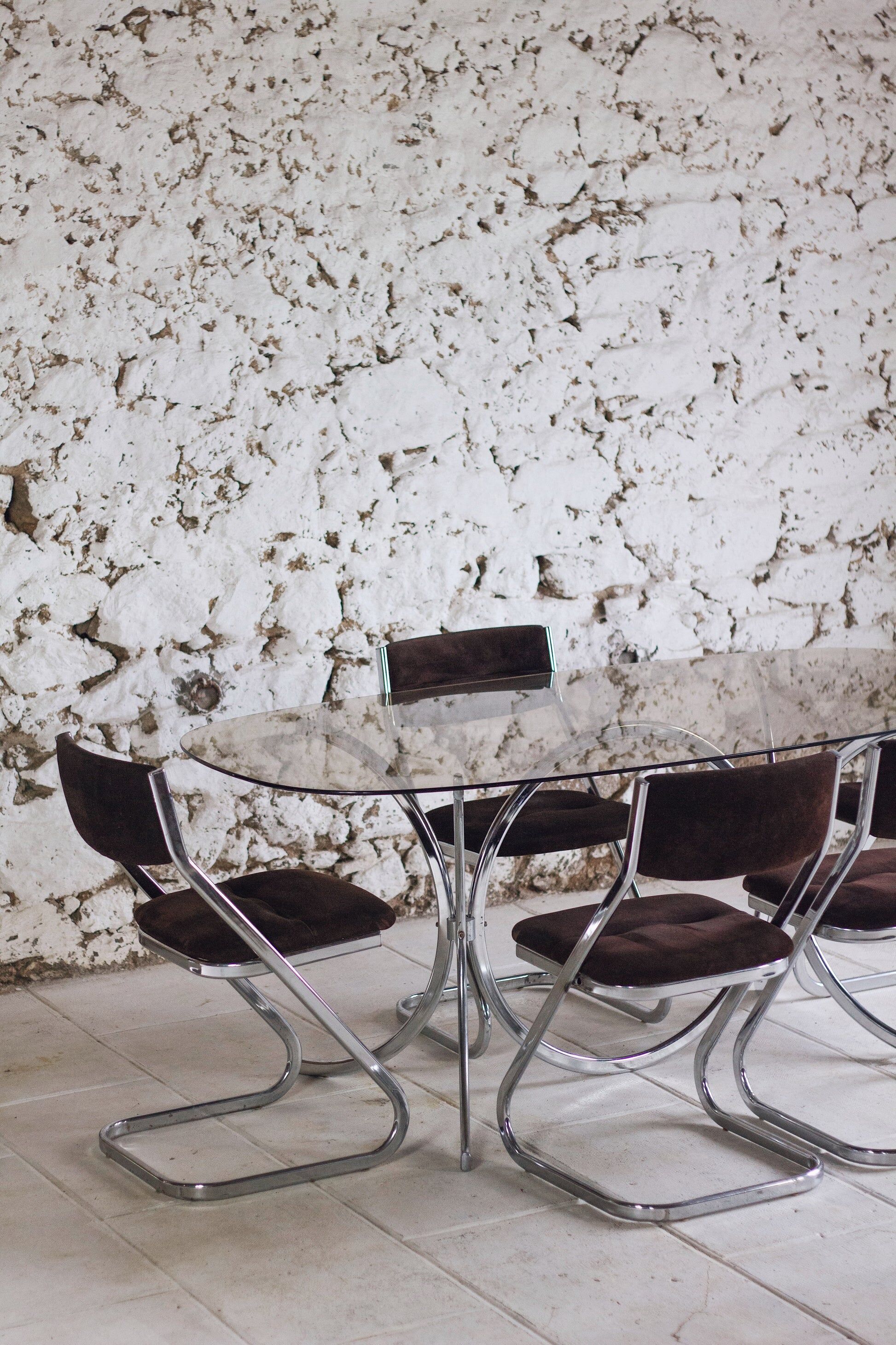 Chrome and smoked glass dining table in the style of Gastone Rinaldi, 1970.