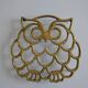 Vintage openwork brass trivet in the shape of an owl or owl