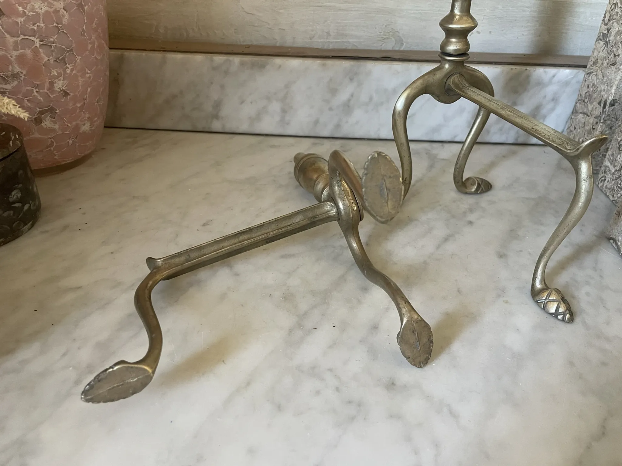 Pair of Victorian brass fire dogs from the late 19th century.