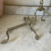 Pair of Victorian brass fire dogs from the late 19th century.