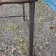 Table with an old ship porthole in brass and a metal base / 110 x 70 x 76 cm