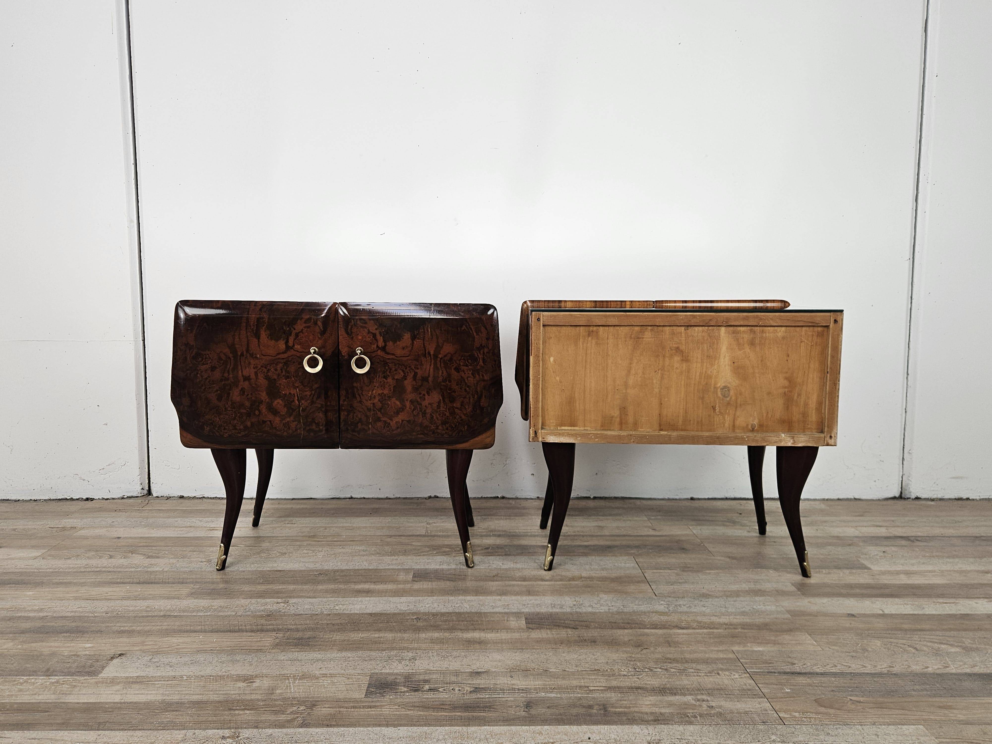 Mid-century mahogany bedside tables with mirrored tops.