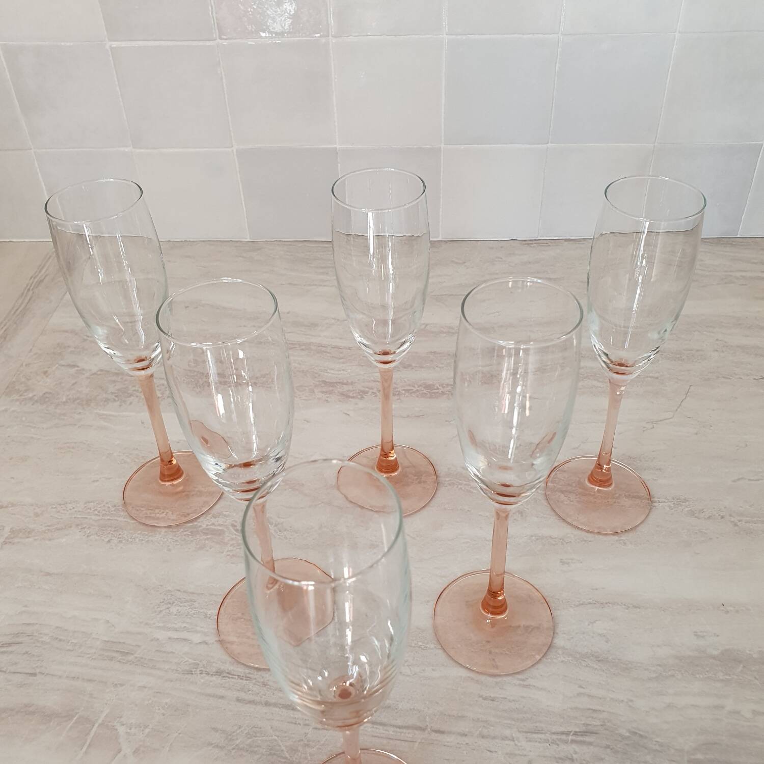 6 champagne flutes with pink stems