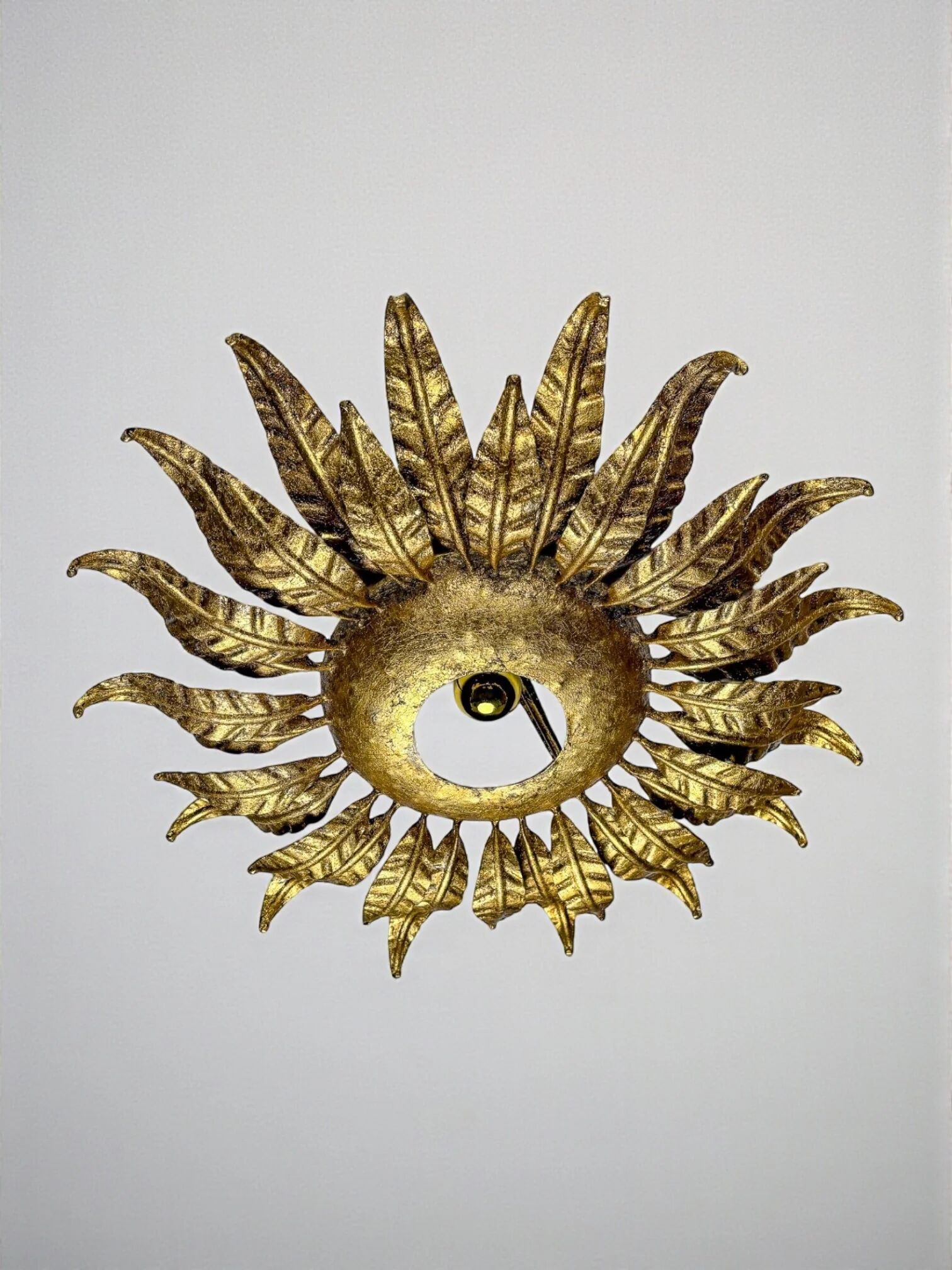 Spanish sunburst ceiling light fixture or sconce in gilt wrought iron, circa 1950s