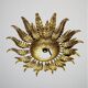 Applique ou luminaire de plafond en fer forgé doré en forme de soleil espagnol, vers les années 1950.