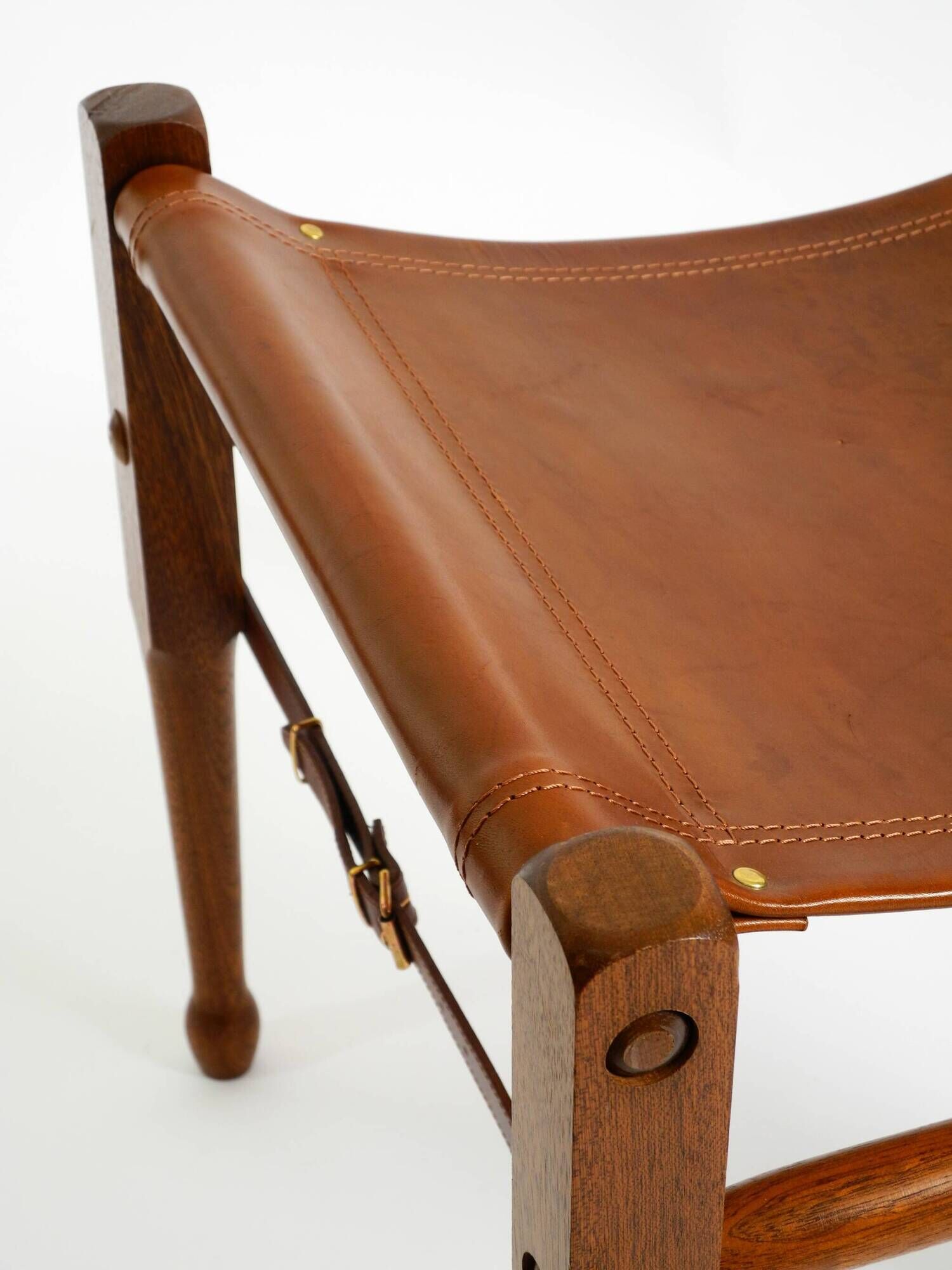 Rare 1990s safari stool with a teak frame and a seat made of brown saddle l