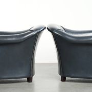 Set of dark blue cow leather club armchairs with a unique design