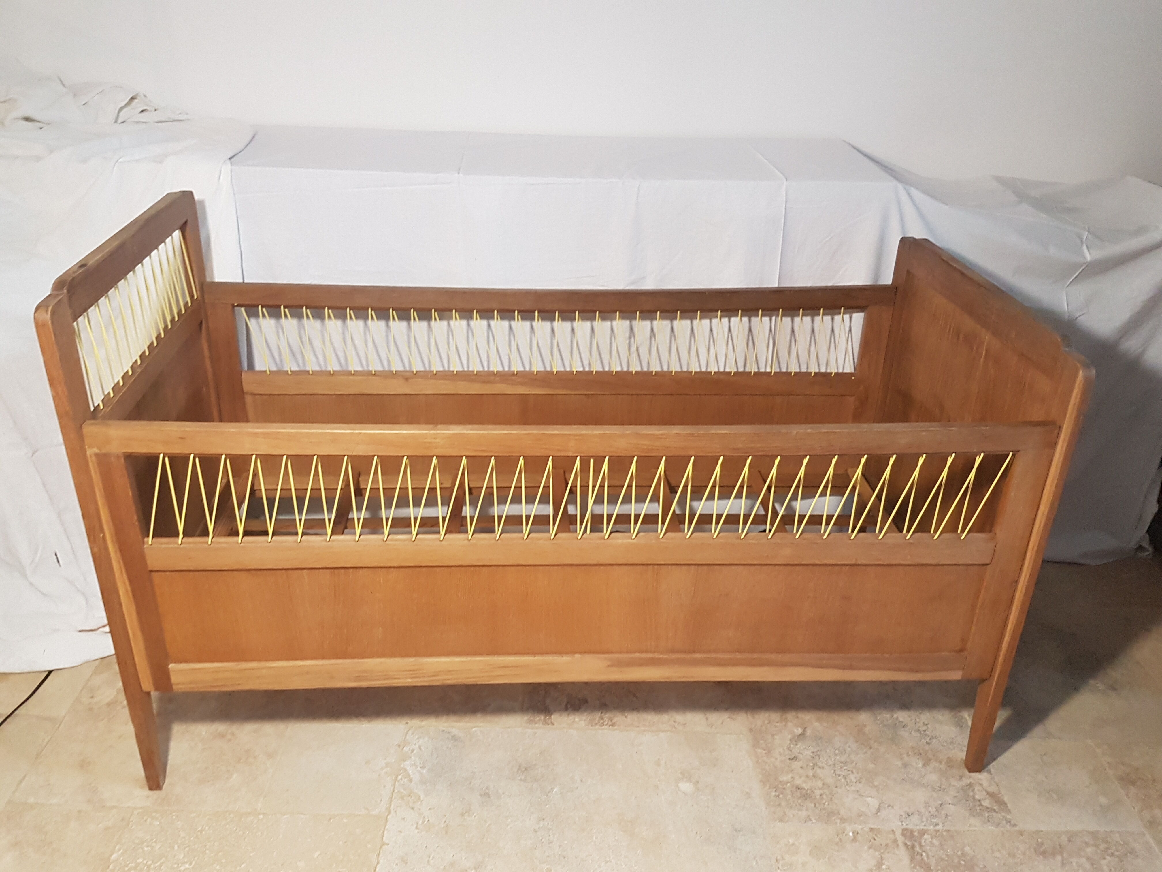 Children's bed made of wood and yellow scoubidou, 1950s.