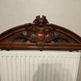 old pediment in carved walnut