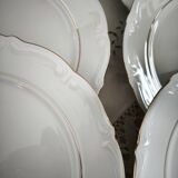 12 flat plates in porcelain with double gold rim.