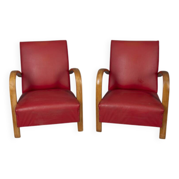 Pair of vintage 1950's armchairs in red leather, italian design