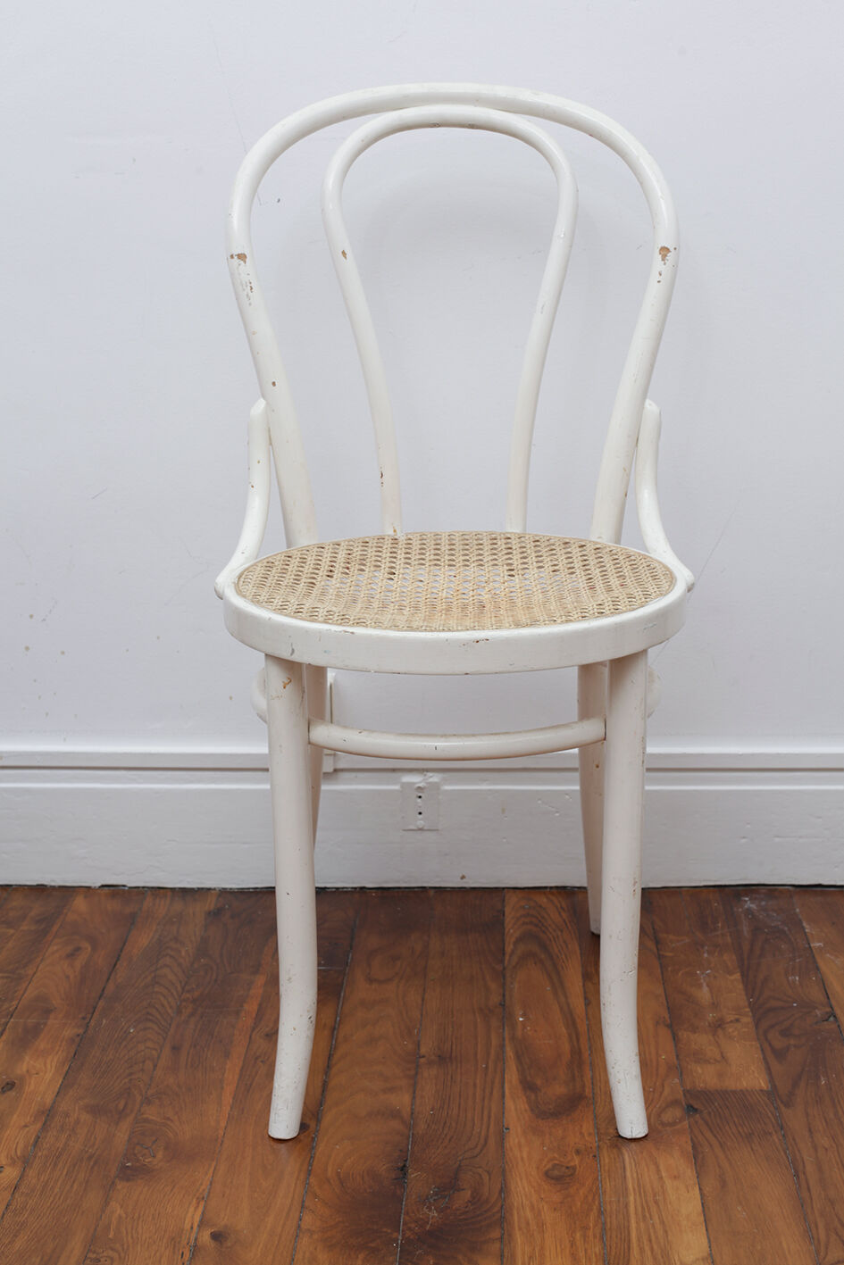 White wooden chair with cannage