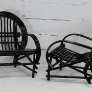 Pair of black lacquered rattan armchairs. France, cira 1960.