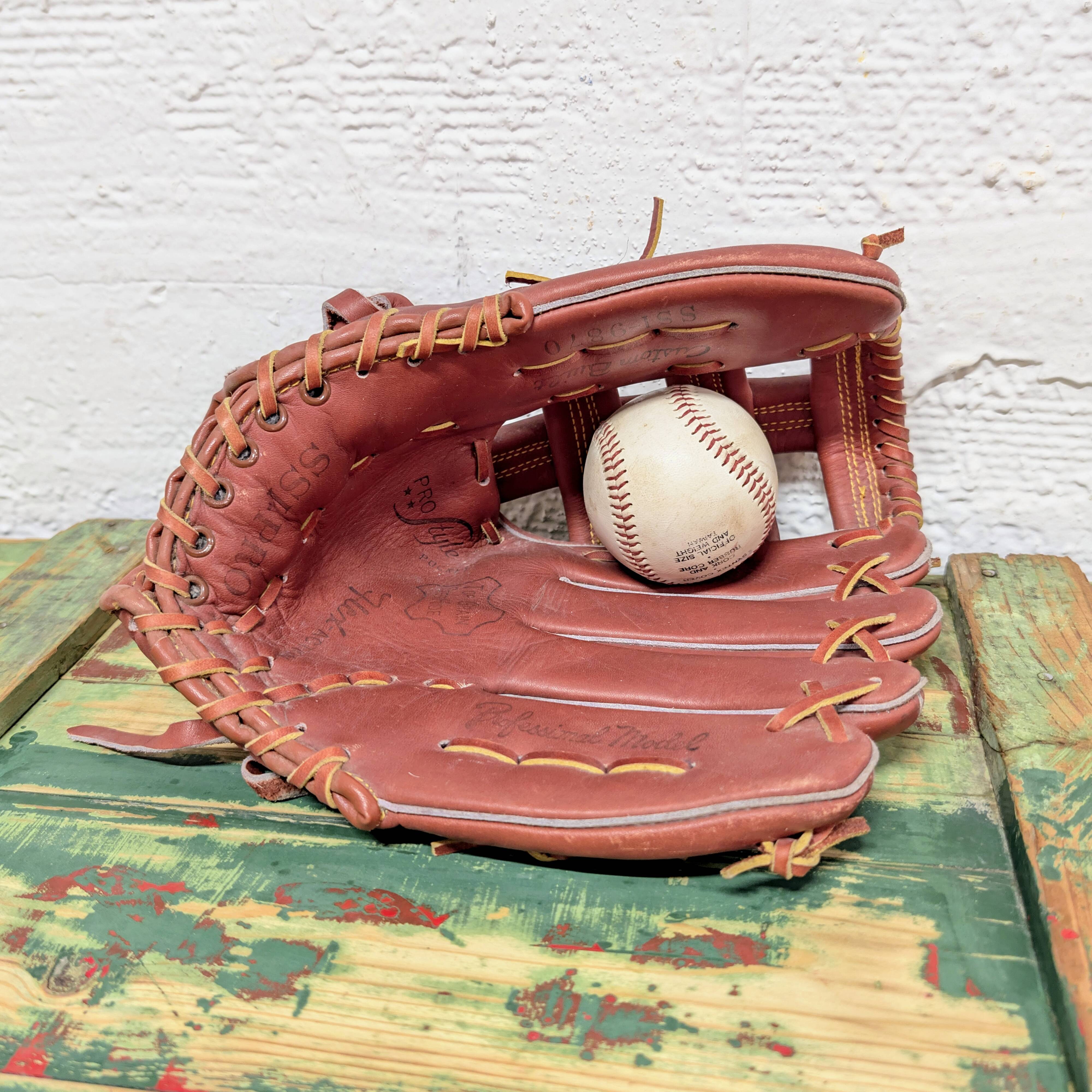 Baseball glove and ball