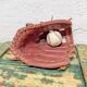 Baseball glove and ball