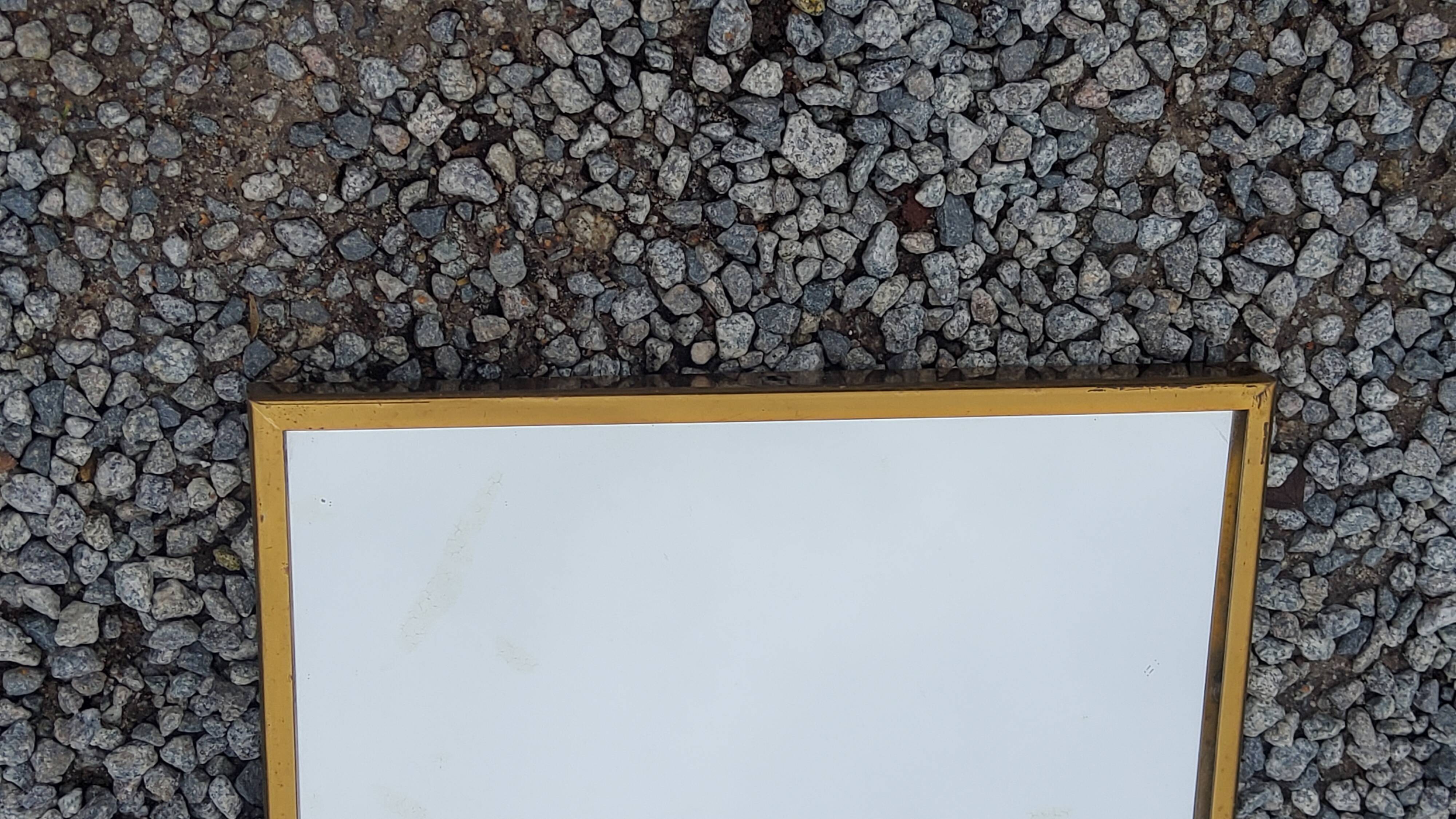 Mirror of the 70s in gilded metal, 60x35 cm