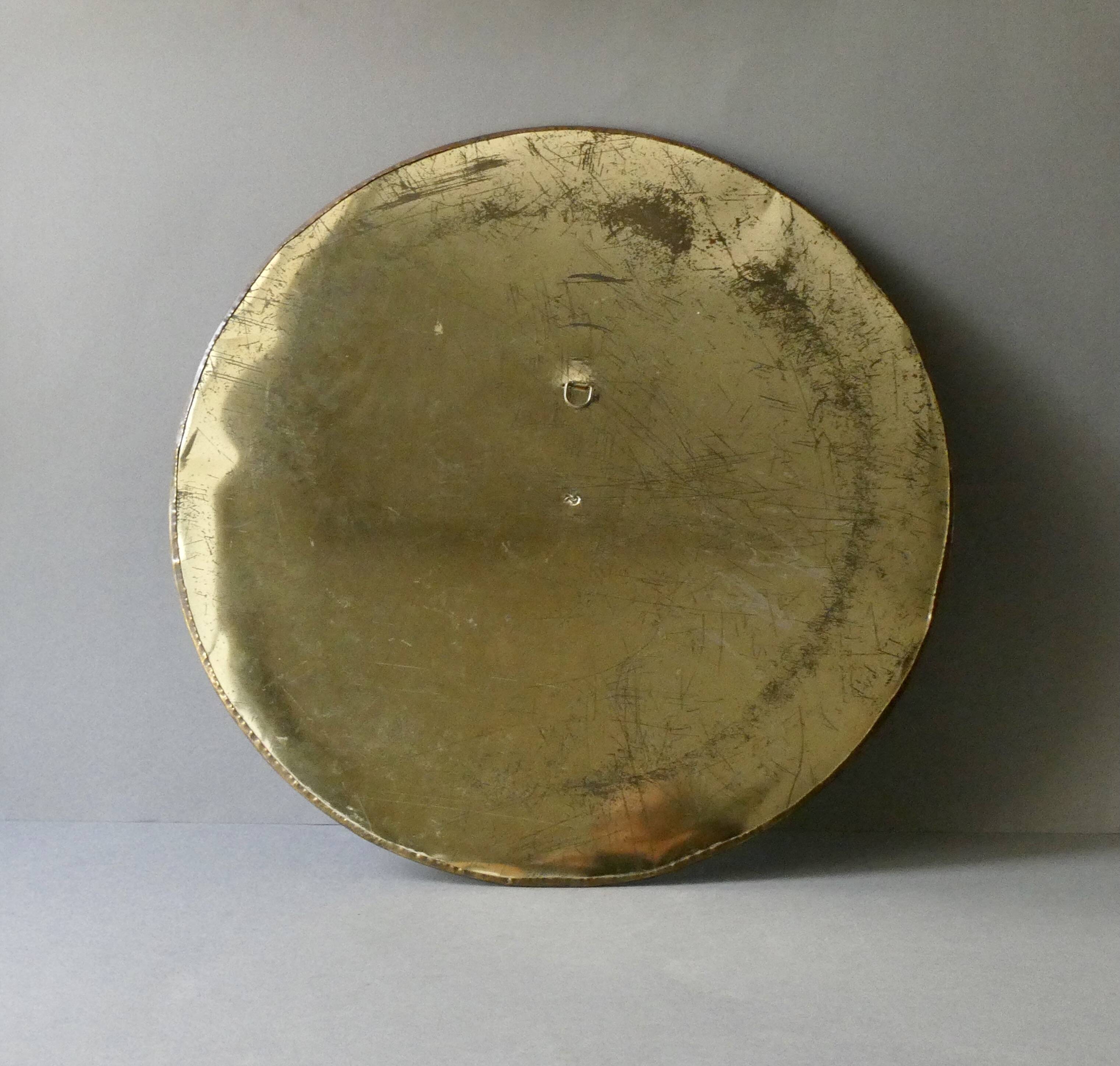 Large round Moroccan mirror in chiseled brass and copper, 1970s-1980s