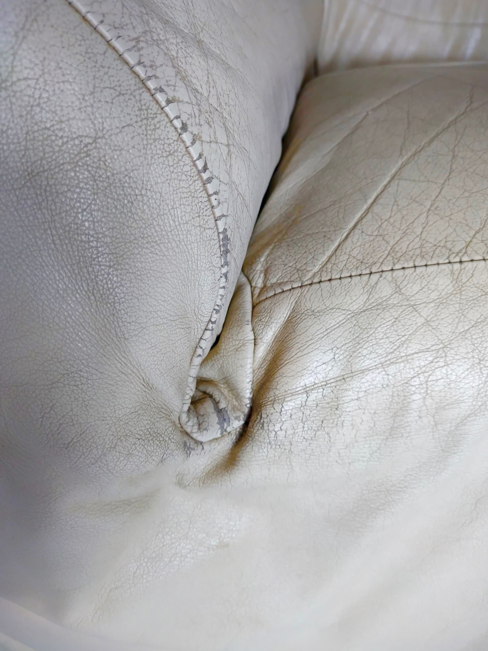 Leather armchair and cream-coloured foam, France , circa 1970