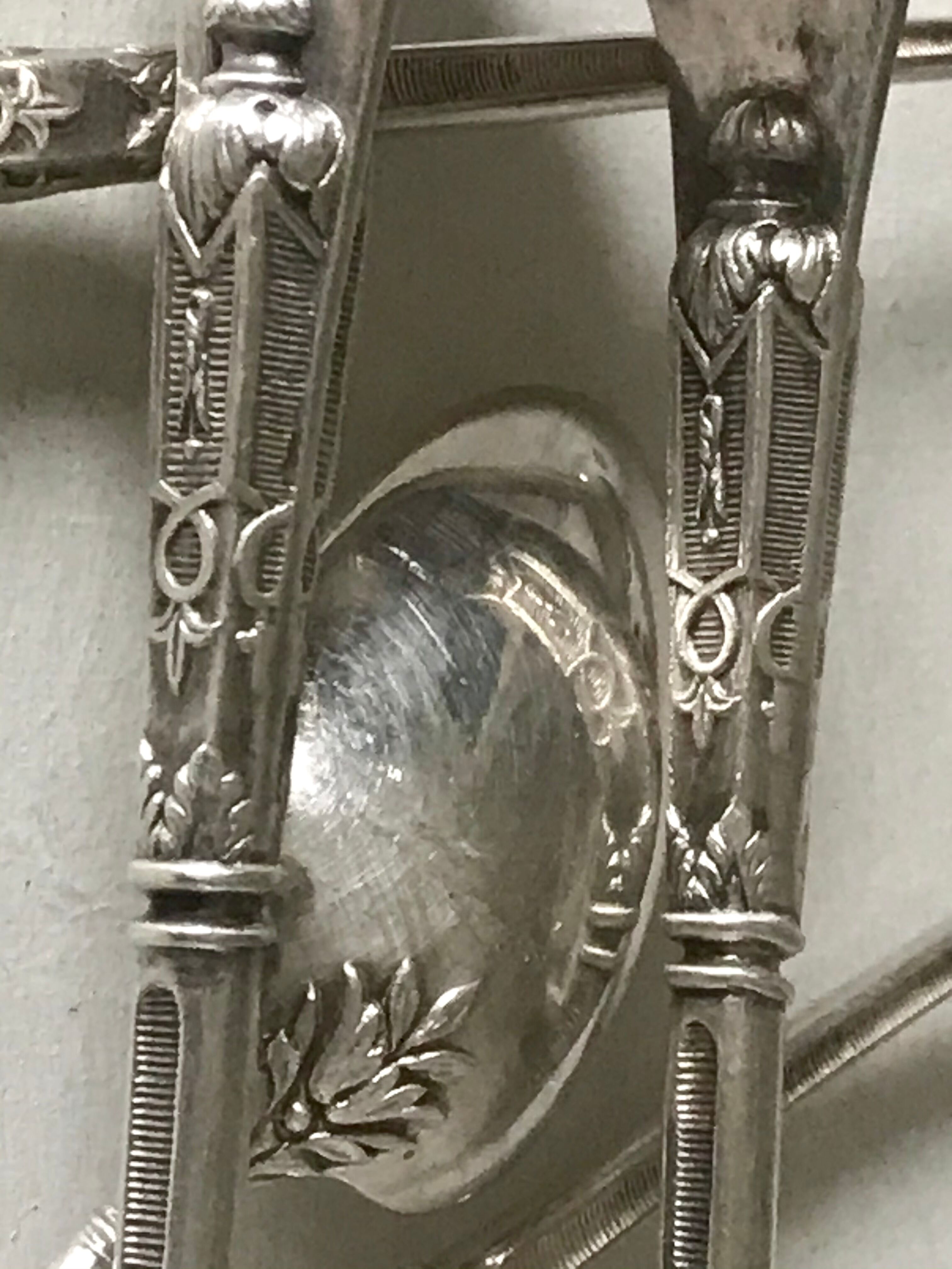 12 teaspoons silver metal