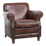 Sheepskin armchair with a classic finish and decorative studs.