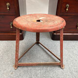 Red tripod industrial metal stool