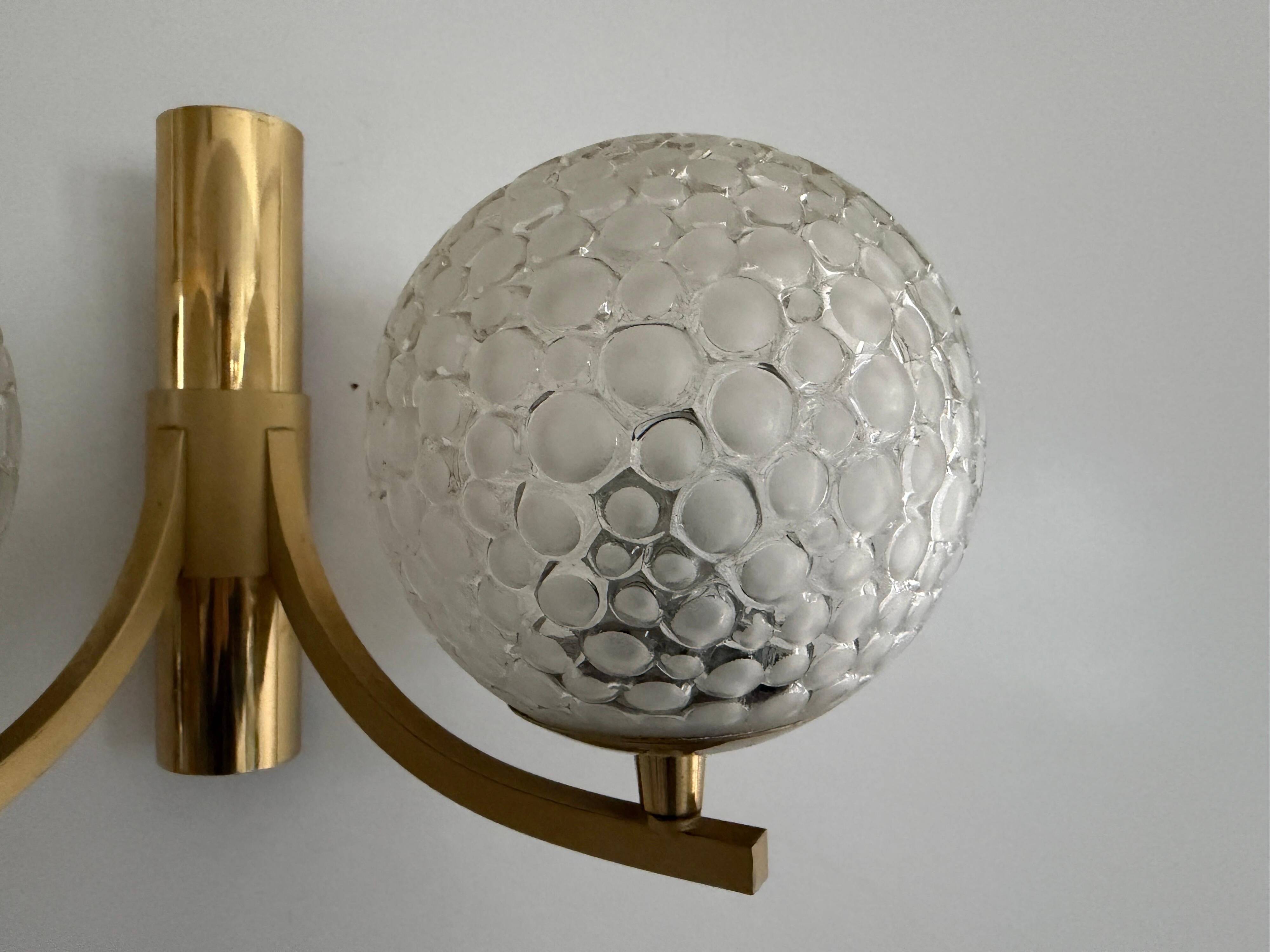 Simple two-armed wall light in brass and glass by Ball and Ball, Kaiser, 1960s, Germany.