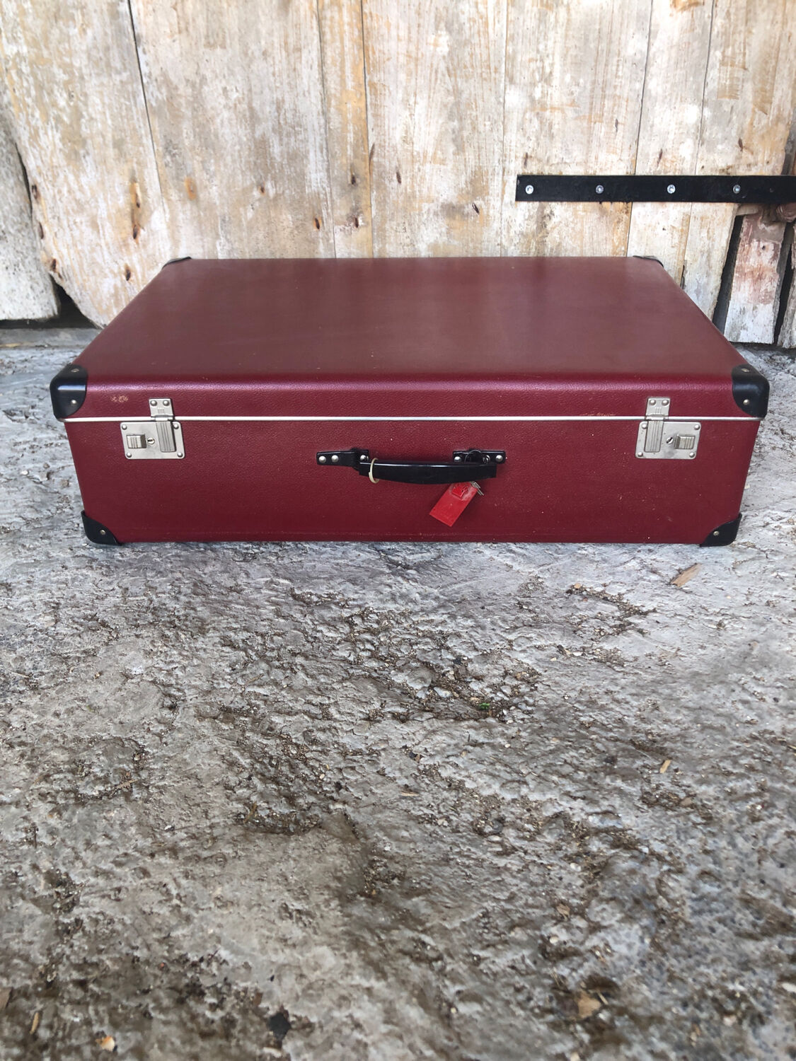 Old suitcase red cardboard bordeaux clasp metal vintage