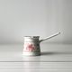 Turkish coffee maker - antique milk jug in white enamel Come Poupoule Genevière Lethu.