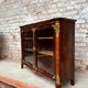 Low showcase in rosewood veneer of the regency xviii th century