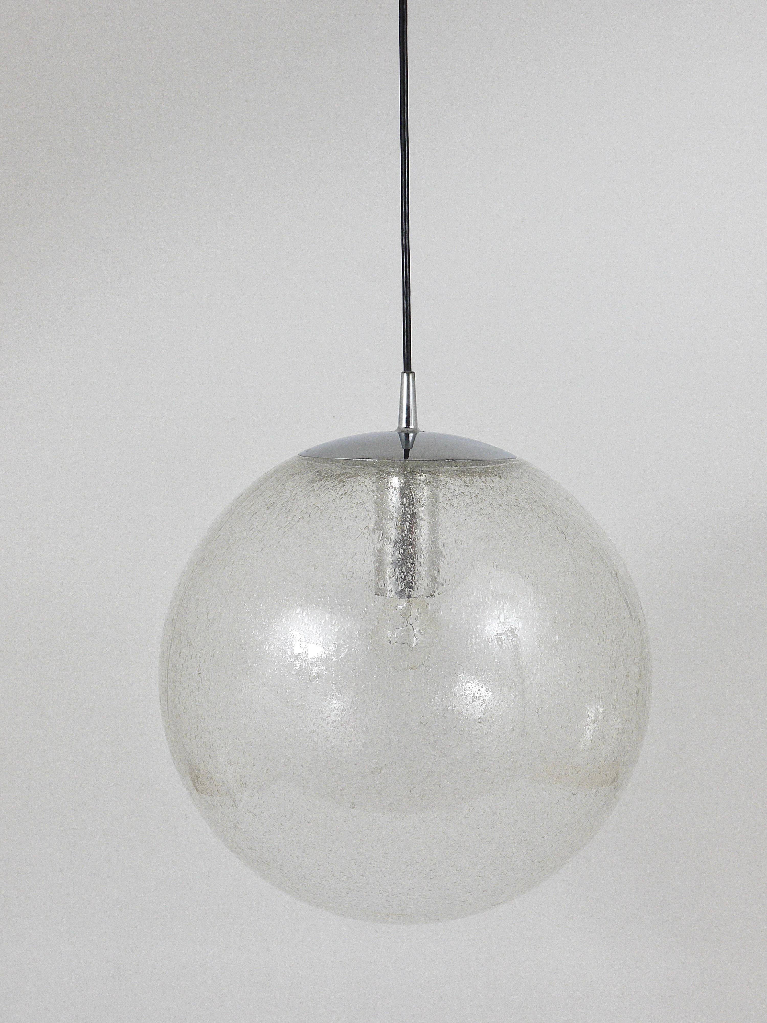 Large glass globe pendant light with bubbles and chrome by Peil & Putzler, Germany, 1970s.