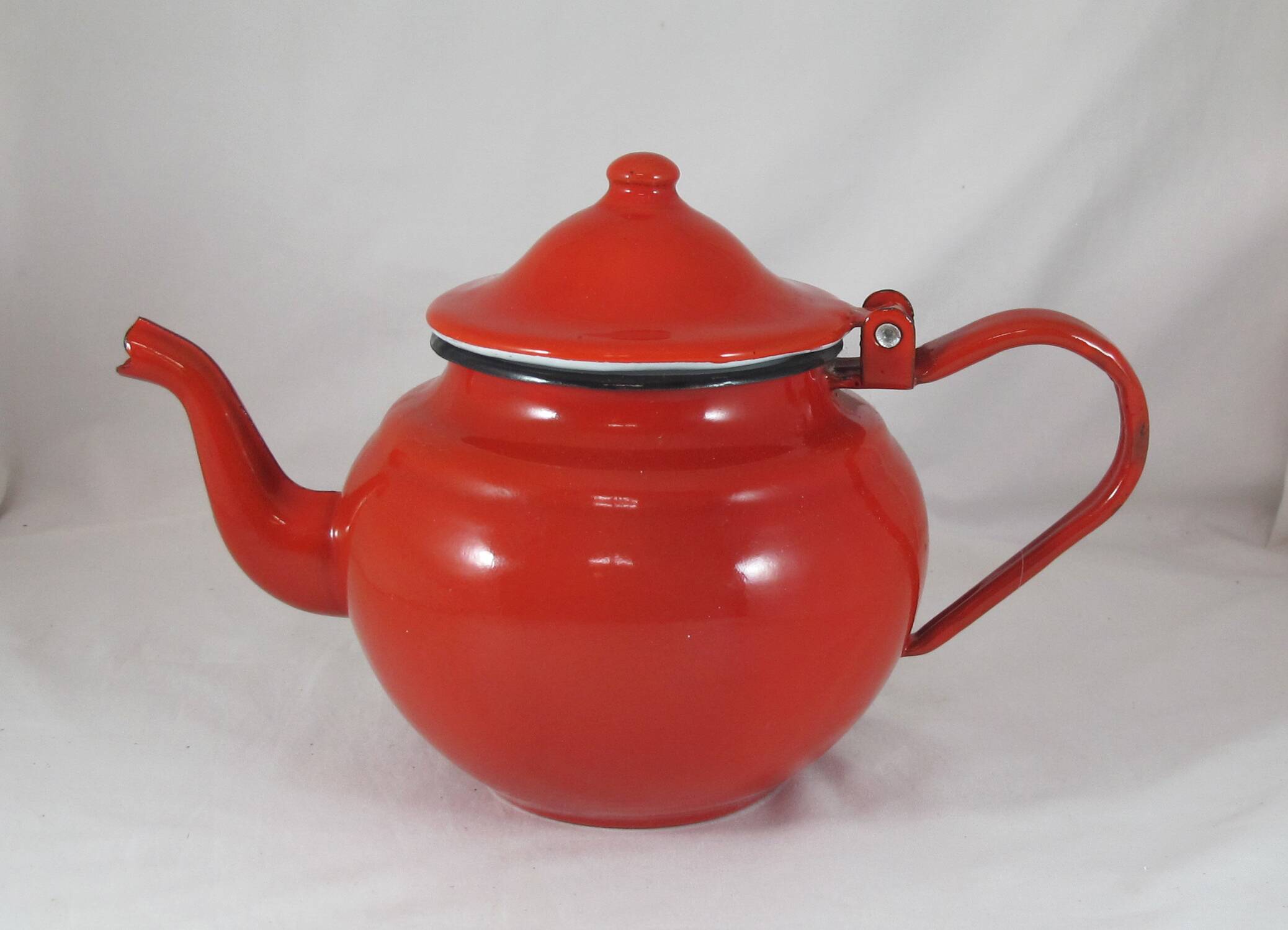 Vintage teapot coffee maker in red enameled metal